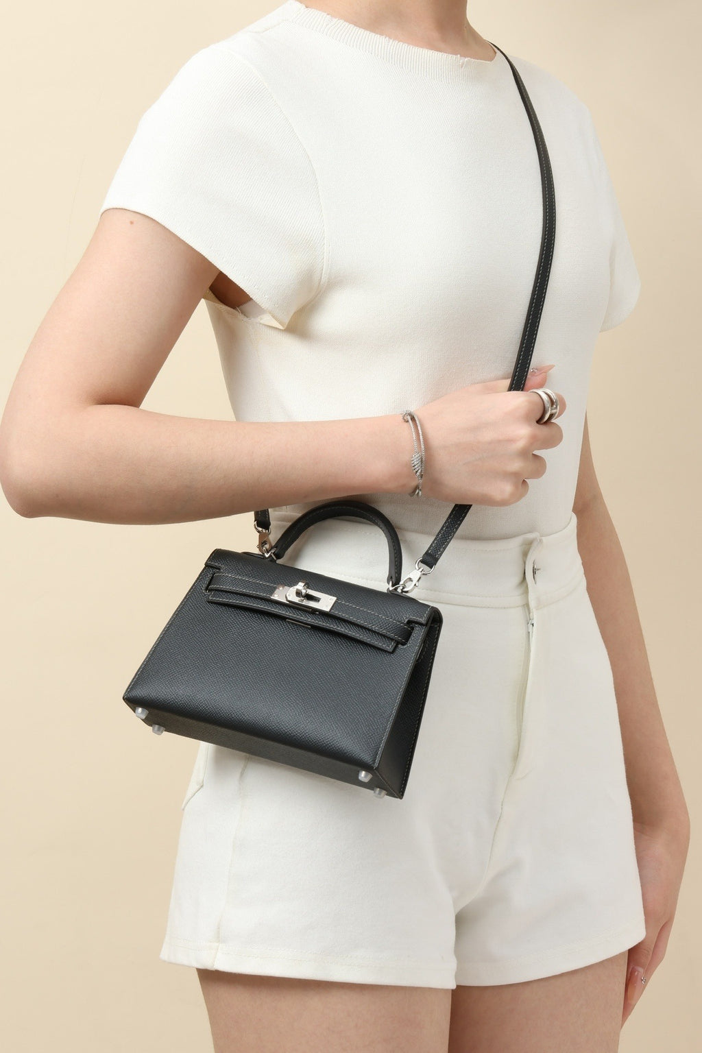 Mini Leather Elegance by Lorvien Maison – Luxury Women’s Handbag worn casually with a structured silhouette.